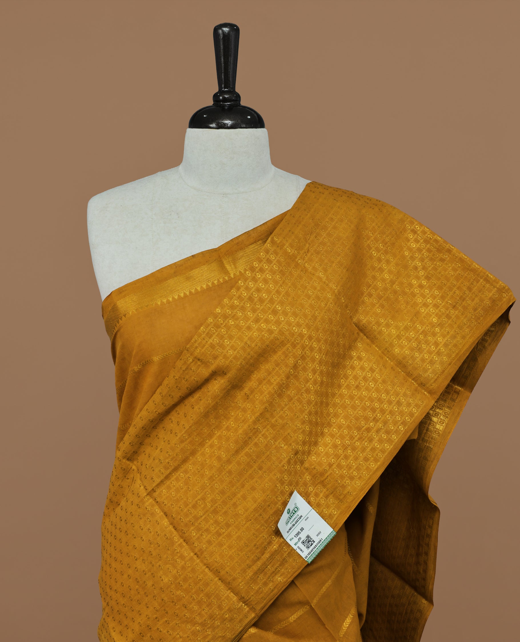 Mustard colour Sungudi cotton saree featuring Gold zari Stripes on body, Gold Small check zari on Self colour border, paired with matching blouse piece.