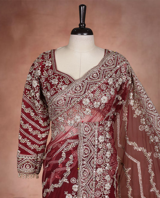 Maroon Colour net designer Wedding saree featuring all over floral embroidery with sequin detailing and an ornate scalloped border, finished with a matching embellished blouse.