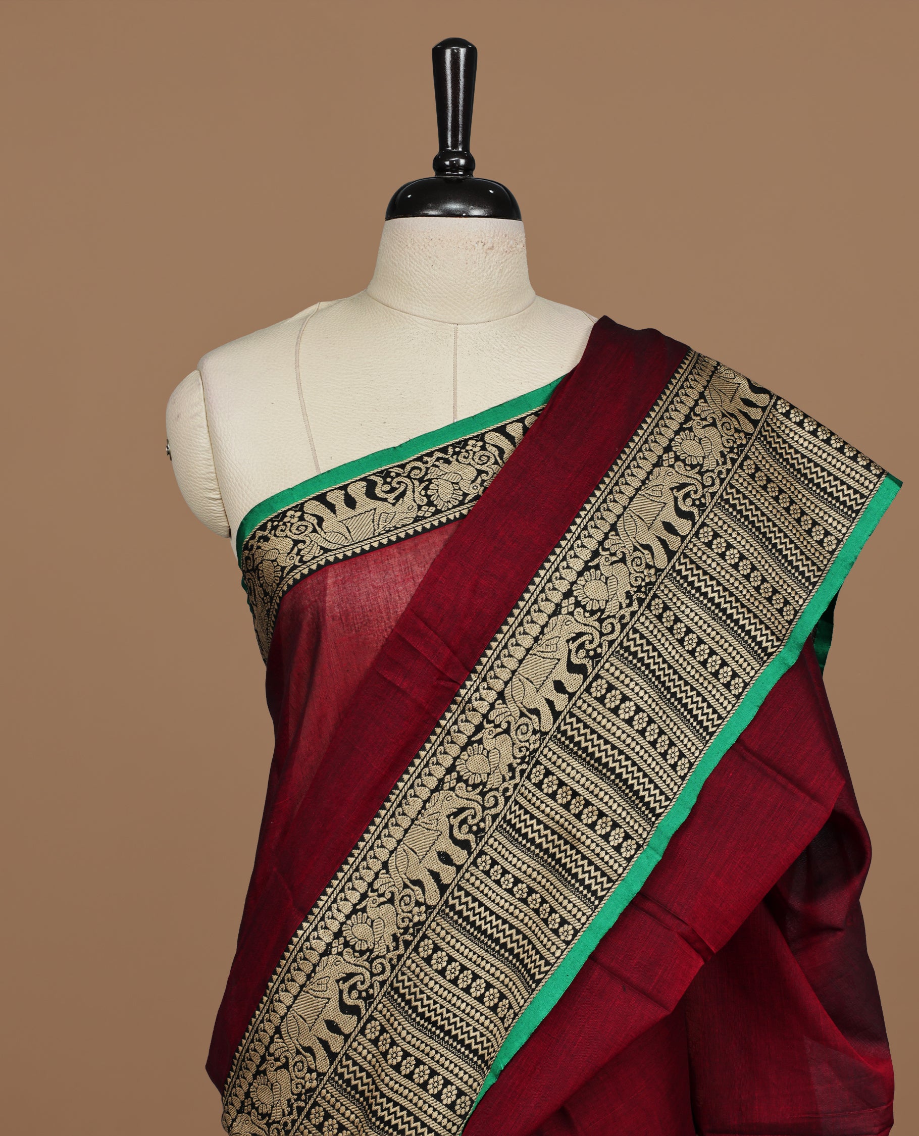 Maroon colour Narayanapett cotton saree Featuring Elegant plain Body, complemented by Contrast Black colour with cream zari border, paired with matching blouse piece.