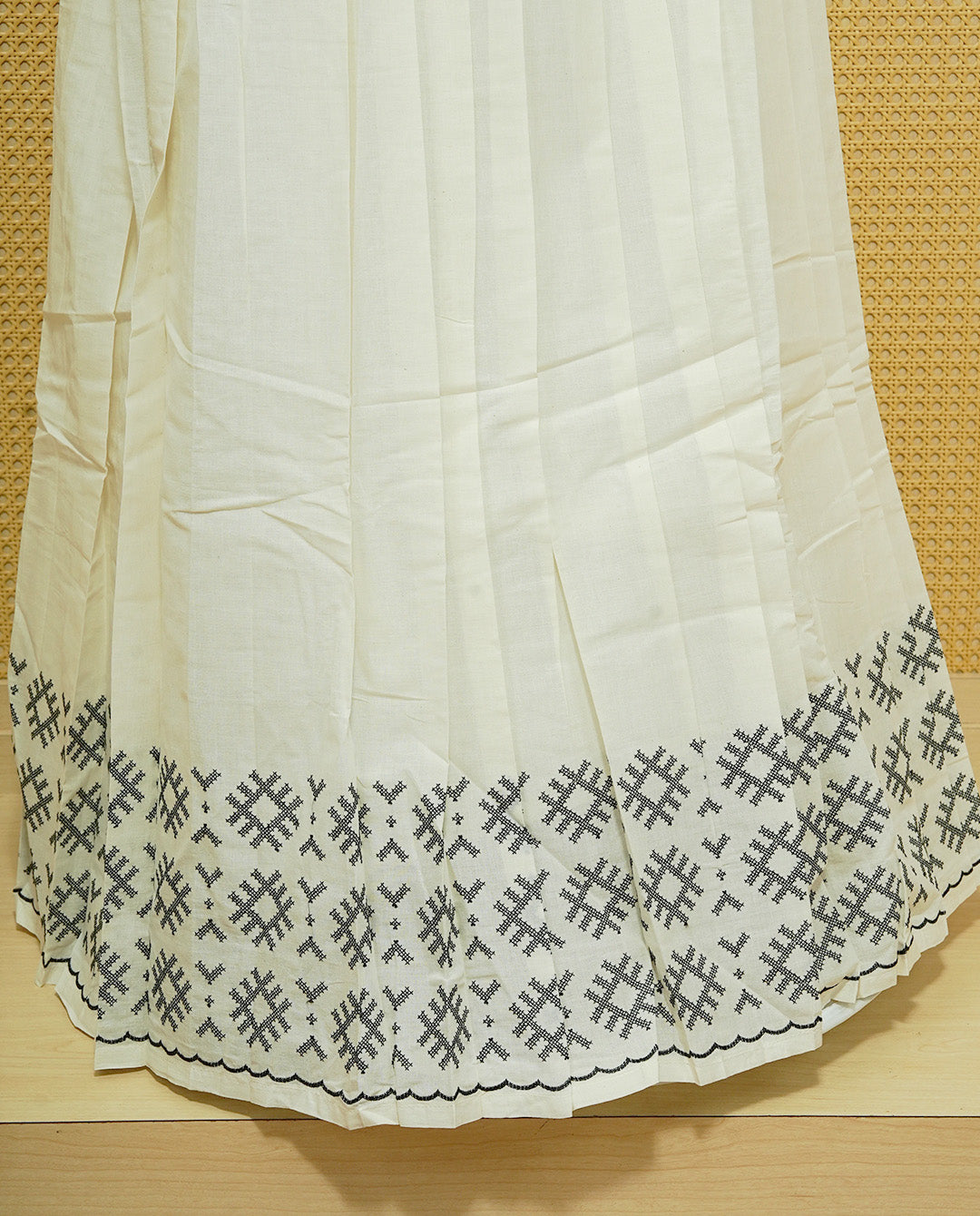 Cream colour cotton Stitched Skirt With Black colour thread pattern Scallop border.