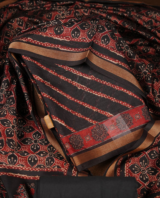 Black colour churidar material featuring printed body fabric, paired with a coordinated dupatta and matching solid bottom.