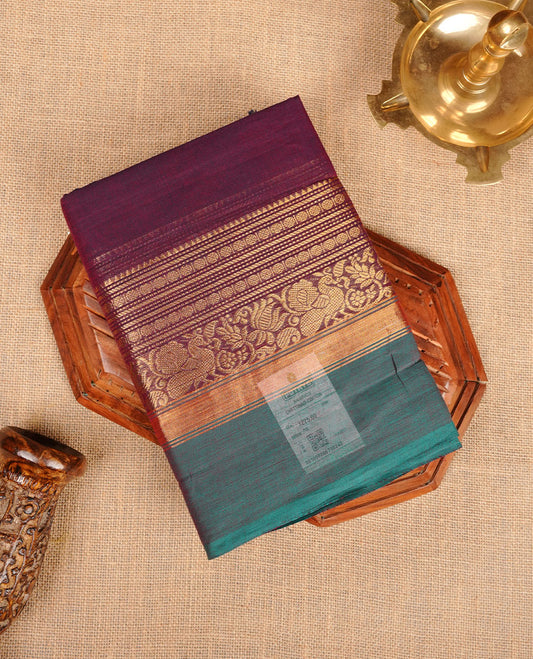 Wine colour chettinad cotton saree featuring plain body, with matching traditional gold zari border paired with matching blouse.