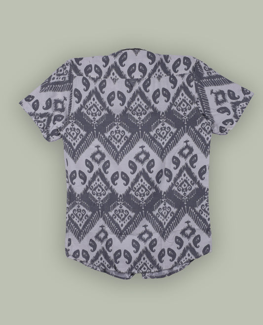 Off white colour shirt featuring stylish grey prints all over, Designed with a classic shirt collar and short sleeves, this shirt offers a modern yet casual appeal.