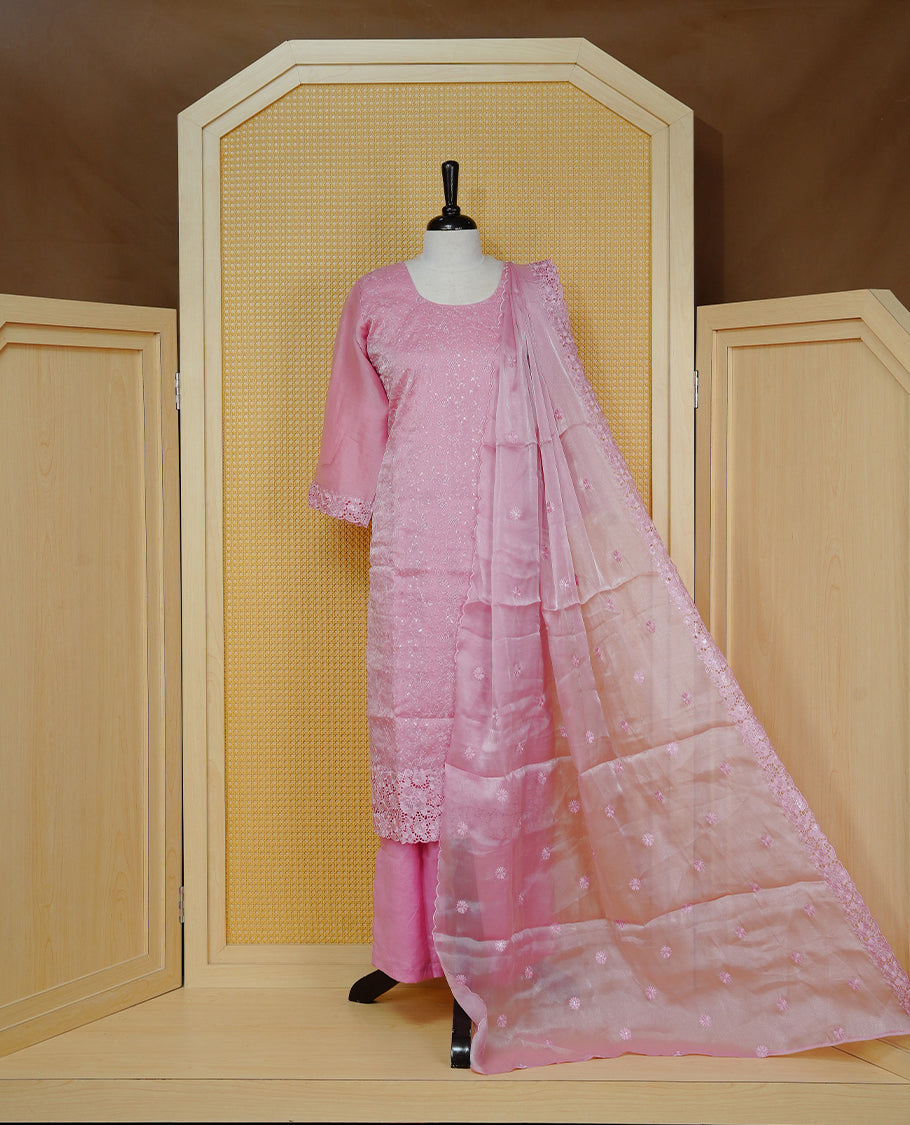 Onion Pink colour churidar set with delicate floral embroidery on the kurta, lace-trimmed sleeves and hem, paired with a matching embroidered dupatta and solid pants.