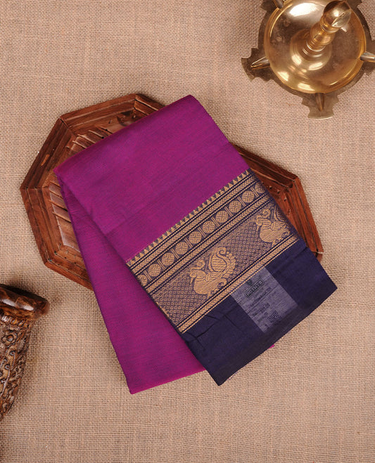 Purple colour chettinad cotton saree featuring plain body, contrast Navy blue colour with traditional gold zari border without blouse.