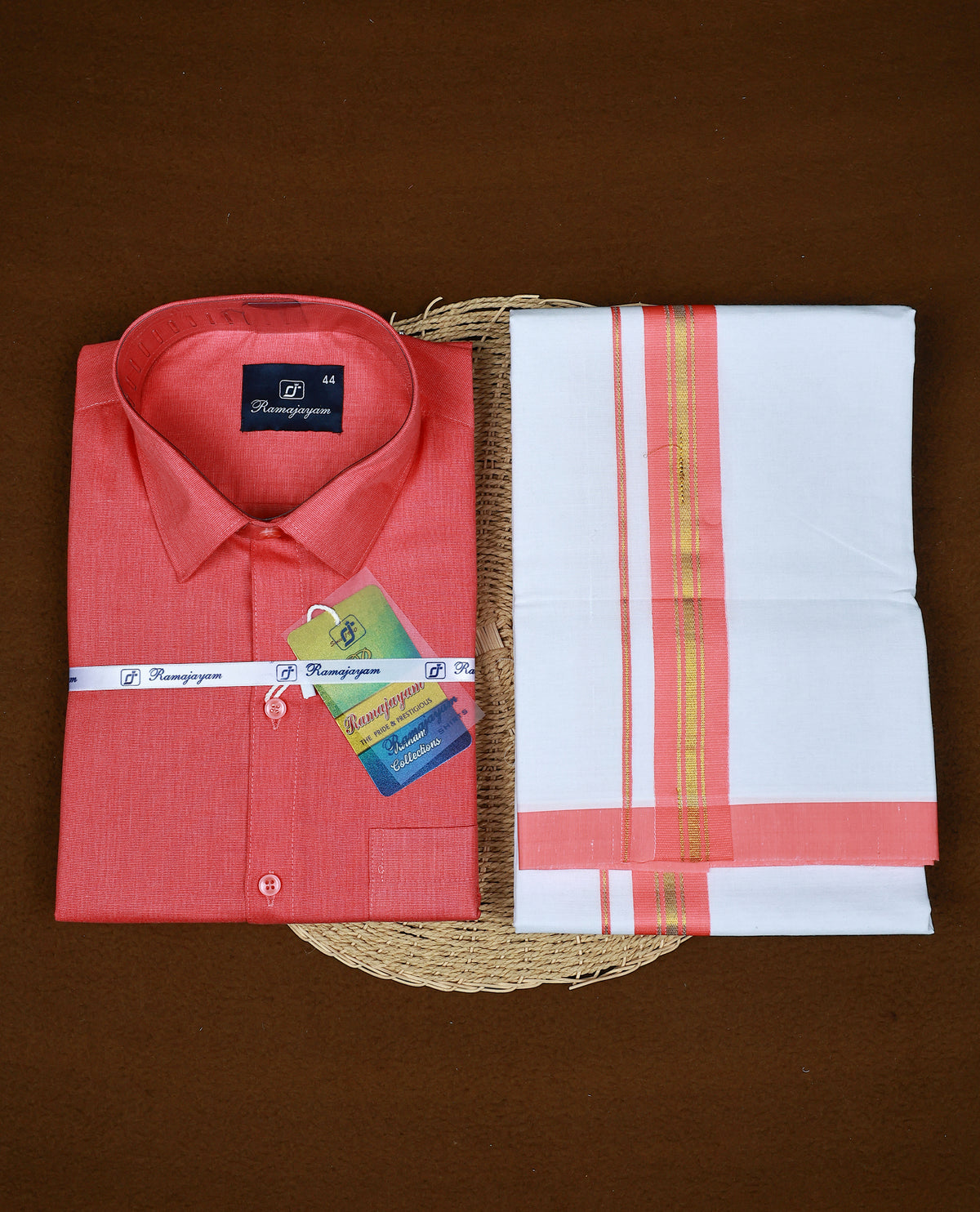 Coral pink colour RAMAJAYAM shirt paired with a matching dhoti, finishing with Coral pink & Gold kara