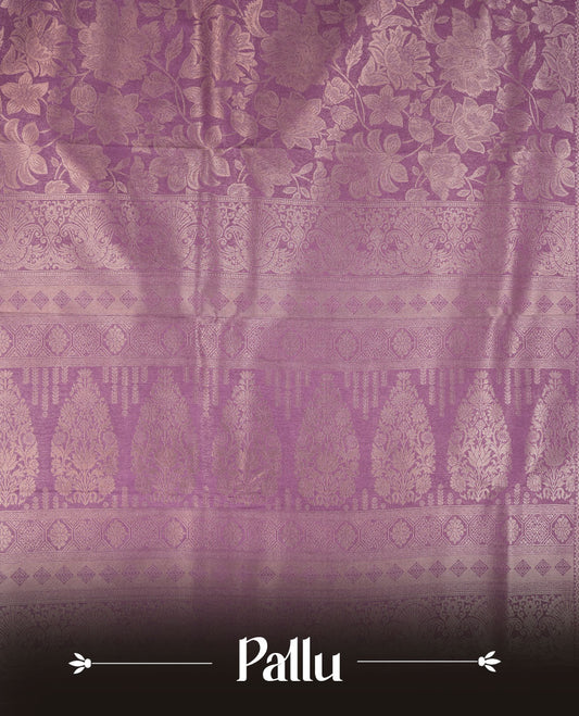 Lavender Purple colour semi soft silk brocade saree featuring elegant floral woven motifs across the body, finished with a self colour ornate border and pallu, paired with a matching blouse.