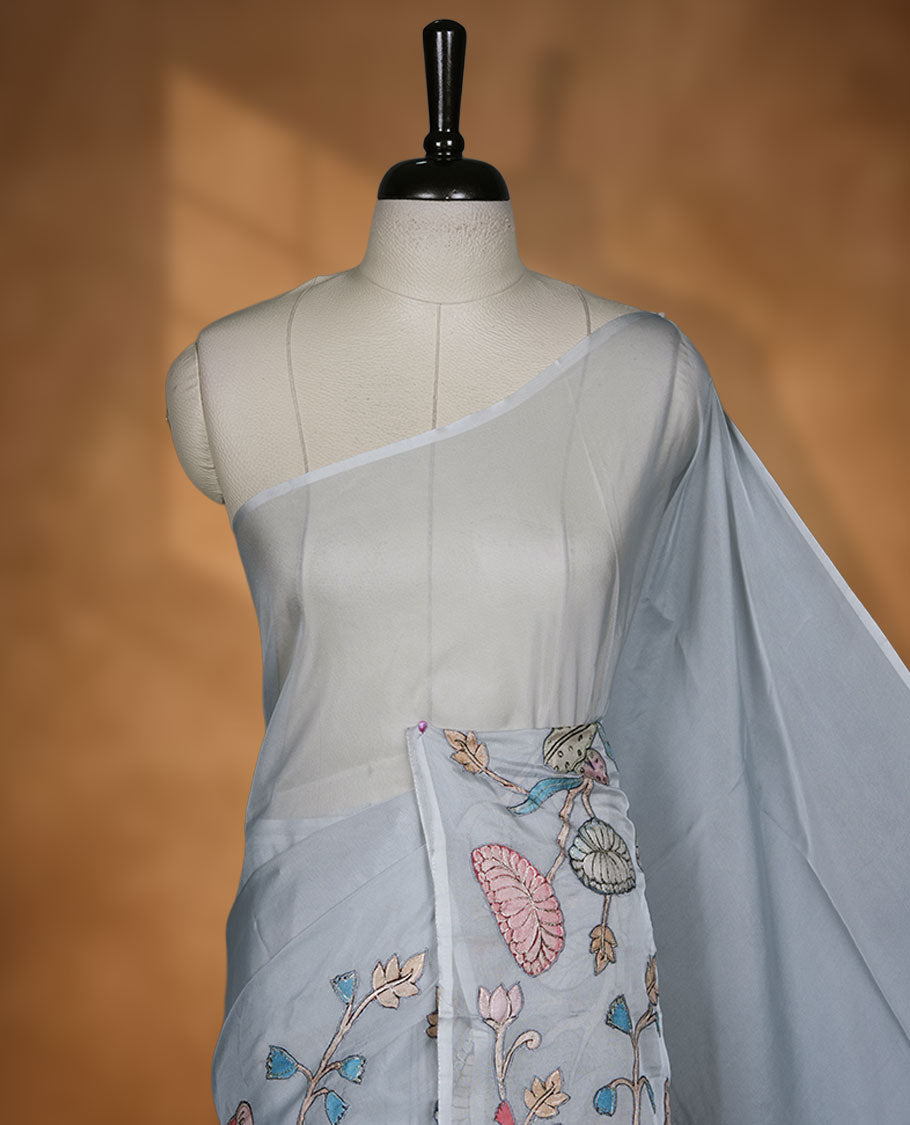 Grey colour organza saree featuring multicolour floral and bird printed motifs on the pallu with a subtle fine border, paired with a matching printed blouse.