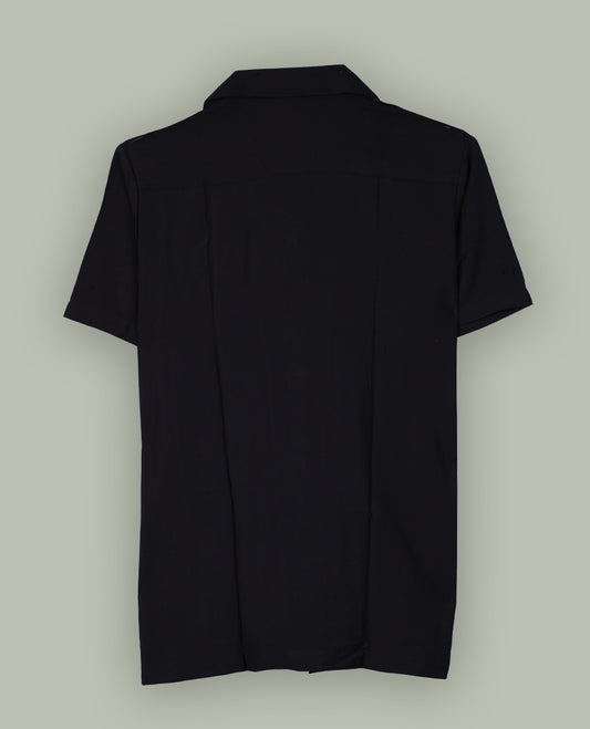 Black colour shirt featuring elegant white embroidery motifs on the body, Designed with a classic shirt collar and short sleeves, it blends contemporary style with subtle detailing.