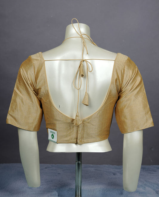 Cream colour silk padded readymade blouse with elbow-length sleeves, a V-neck front, and a deep U-back with tie-up dori.