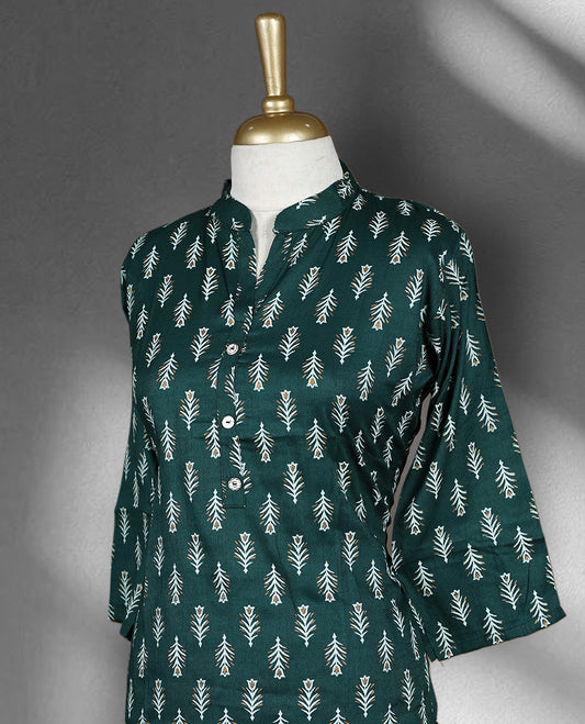 Dark green colour cord set adorned with delicate white leaf motifs, featuring a straight fit kurta with a mandarin collar and matching pants.