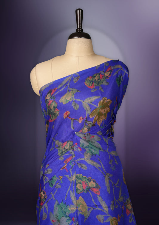 Violet blue colour saree enhanced with a vibrant blue colour floral prints on body & pallu, and  comes with a matching blouse.