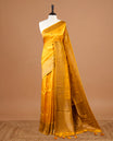 Yellow colour Semi banaras tussar georgette Saree featuring Antique zari motifs on body, enhanced with antique zari border, paired with a matching blouse piece.