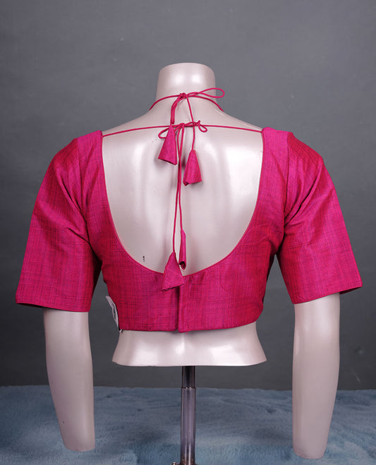 Magenta colour silk padded readymade blouse with elbow-length sleeves, a V-neck front, and a deep U-back with tie-up dori.