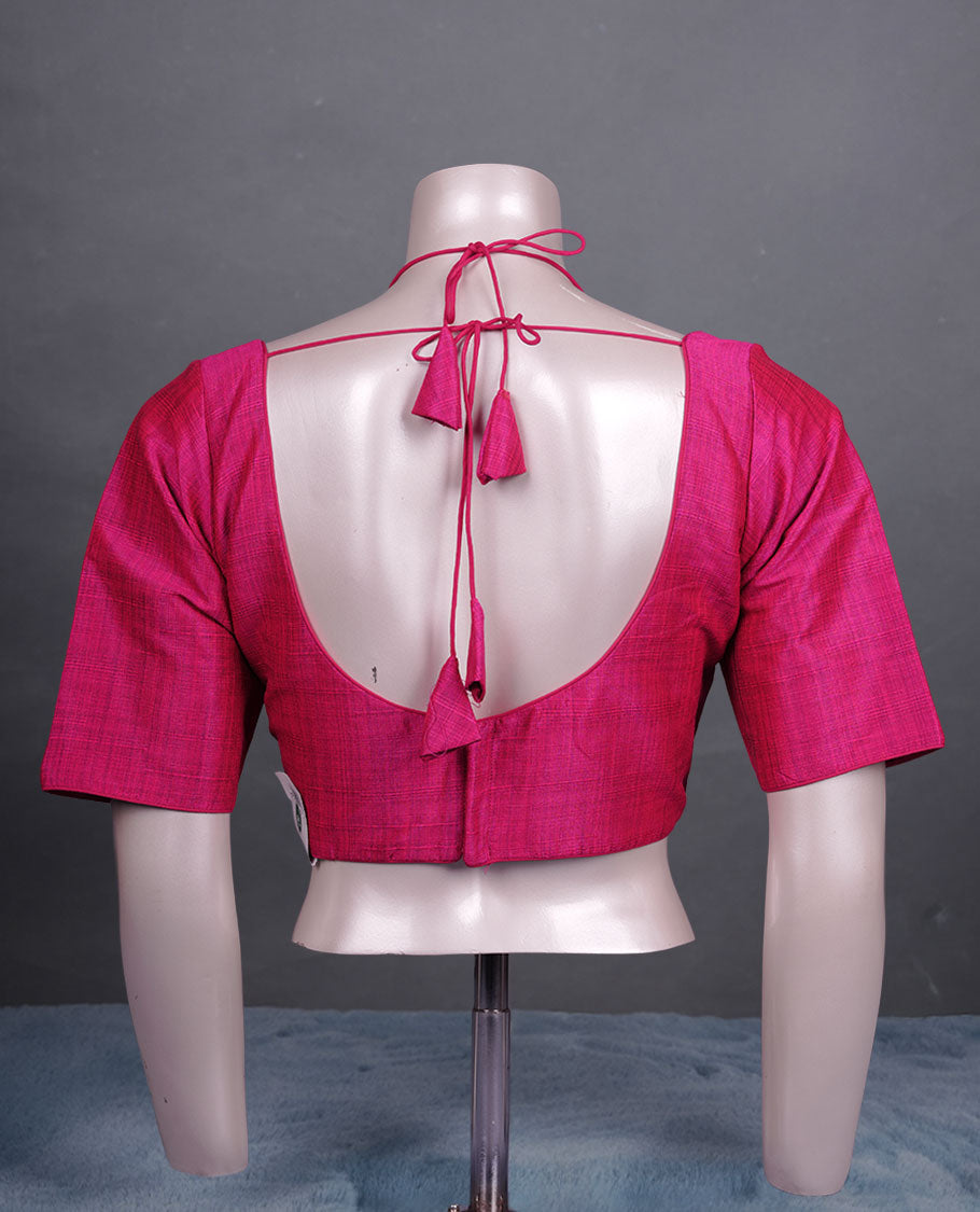Magenta colour silk padded readymade blouse with elbow-length sleeves, a V-neck front, and a deep U-back with tie-up dori.