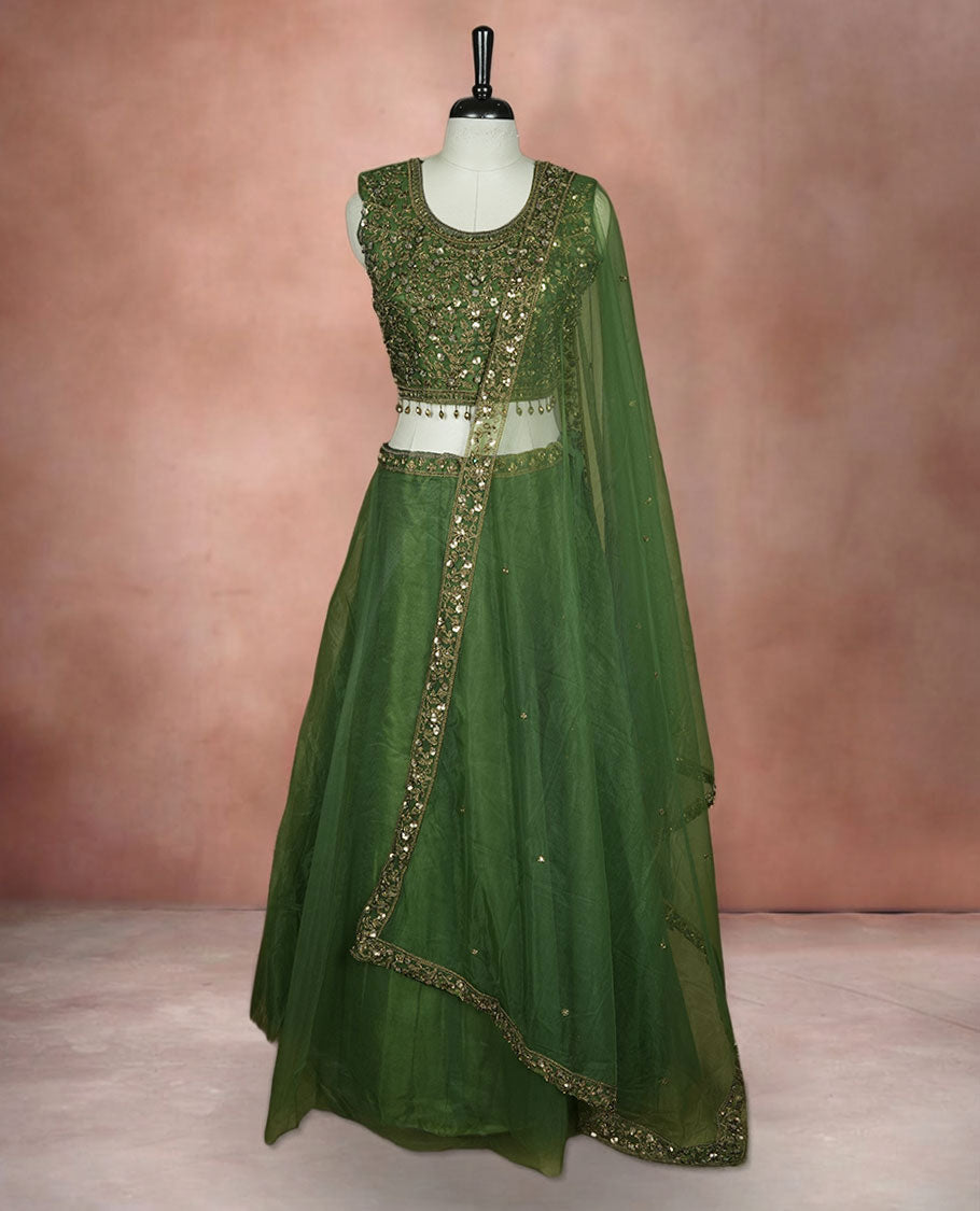 Olive green colour lehenga set with stitched sleeveless Antique thread embroidered & beats worked  blouse featuring sheer neckline, matching stitched flared lehenga, and plain sheer dupatta.