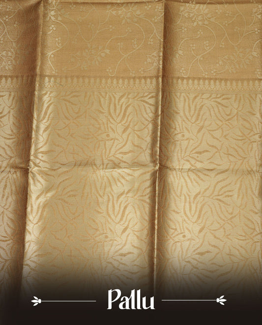 Gold colour semi tussar silk saree, featuring an intricate gold zari floral kodi pattern on the body and pallu, comes with matching blouse.