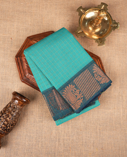 Aqua colour sungudi cotton saree featuring gold zari check pattern across body, contrast Teal colour with gold zari pattern on border, without blouse piece.
