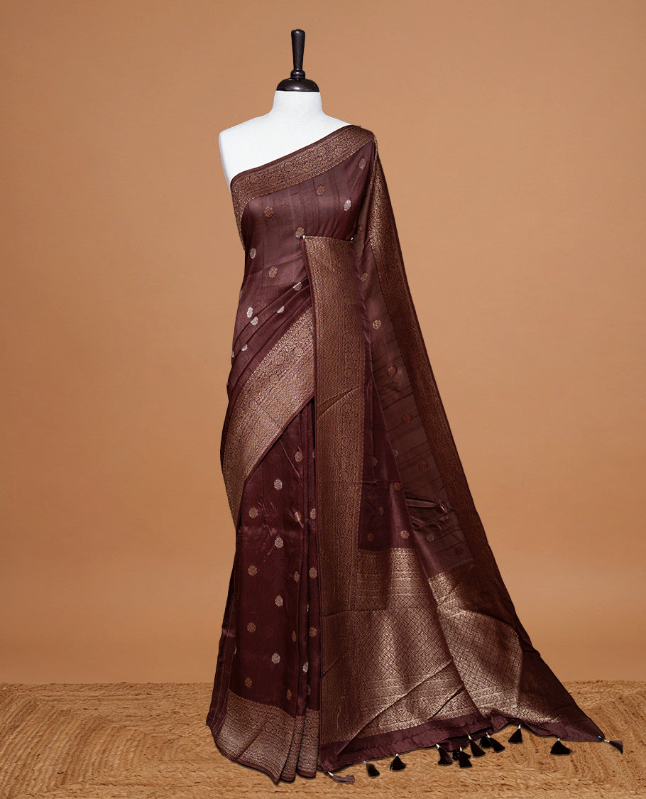 Chocolate brown colour Semi banaras tussar georgette Saree featuring Antique zari motifs on body, enhanced with antique zari border, paired with a matching blouse piece.