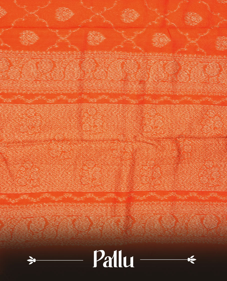 Orange semi Banaras saree with gold zari buta motifs, finished with a traditional gold zari border and pallu, paired with a matching blouse.