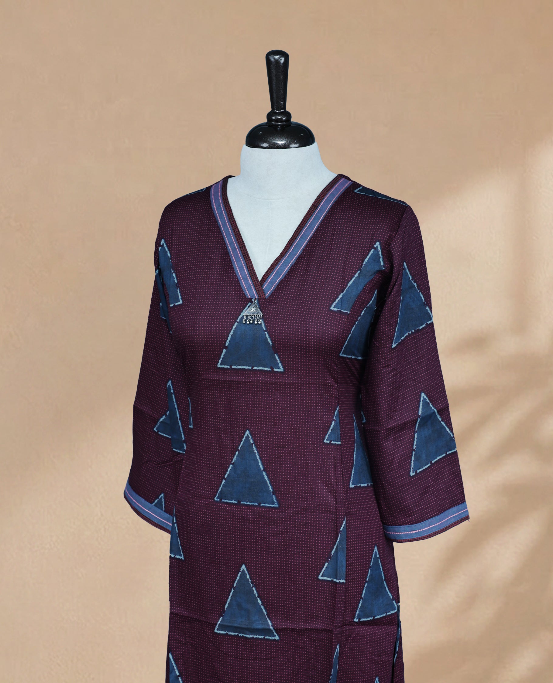 Wine Colour Kurti Featuring Dot & Triangle Pattern On Body ,V-Shaped Neckline  An Thread Detailing On Neck & 3/4 Sleeves