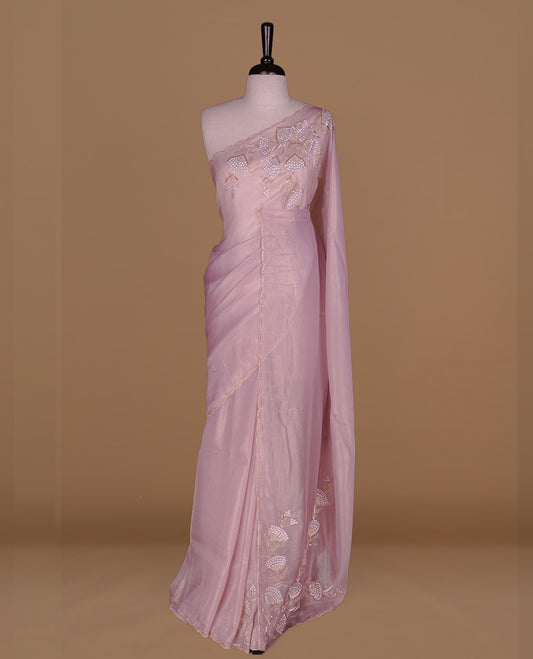 Pastel Pink colour net organza saree featuring thread, sequins, cut beats worked on body, highlighting scalp border, paired with matching blouse piece.