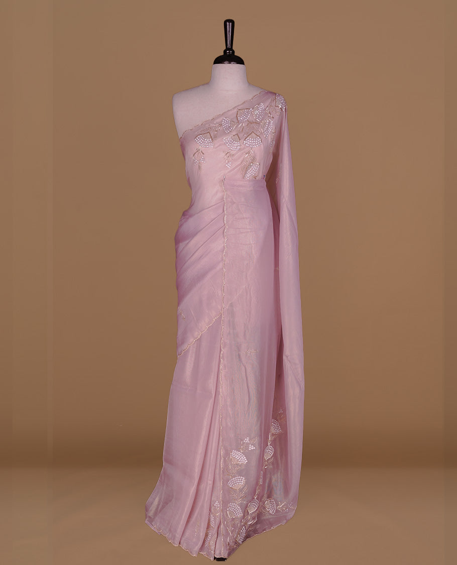 Pastel Pink colour net organza saree featuring thread, sequins, cut beats worked on body, highlighting scalp border, paired with matching blouse piece.