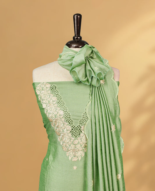 Pale green colour Salwar Material Featuring Cream colour Thread pattern on Neckline & Small Buttas, paired with matching bottom & Same Colour Dupatta.