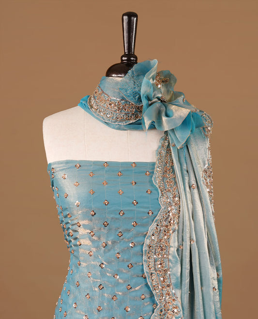 Aqua blue  colour churidhar material featuring cut beads and sequins work on the body, paired with a matching unstitched bottom and worked dupatta.