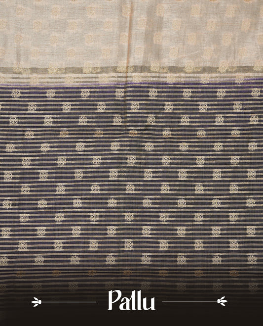 Light Gold Tussar saree featuring Gold zari buttas on body, complemented by contrast Navy Blue Colour with Gold zari border, comes with matching blouse piece.