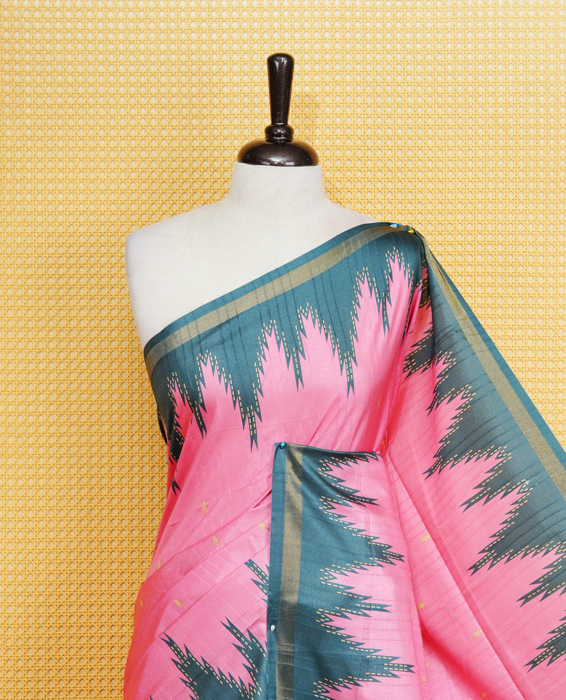 Pink and  Dark Green Colour Kattan silk saree featuring buttas all over the body, a temple-designed border &  a contrasting striped pallu with tassels. Paired with a matching contrast-striped blouse piece.