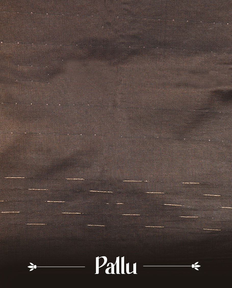 Black colour semi jute saree highlighting gold zari stripped body with white motifs, without border and paired with matching blouse.