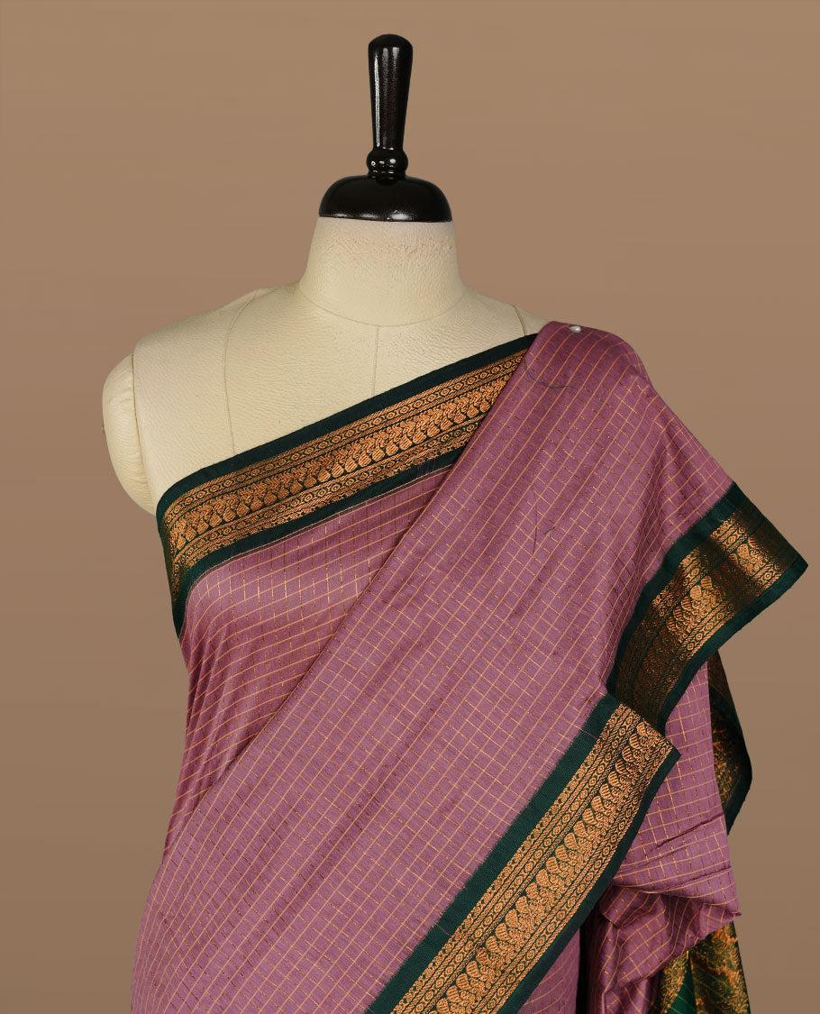 Lavender colour kalyani cotton saree featuring gold zari check pattern on body, complemented by green colour with Antique zari border, paired with matching blouse piece.