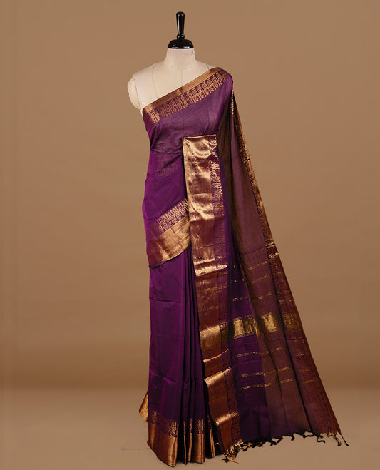 Deep purple colour chettinad cotton saree featuring elegant plain body, complemented by self colour with zari border, paired with matching blouse piece.