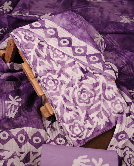Purple colour churidar material featuring white floral printed body, paired with a matching chevron printed dupatta.