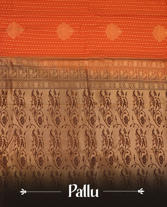 Rust orange colour semi silk saree featuring gold zari dotted stripes and stripes on body highlighting contrast dark chocolate gold zari  floral kodi border , paired with matching blouse