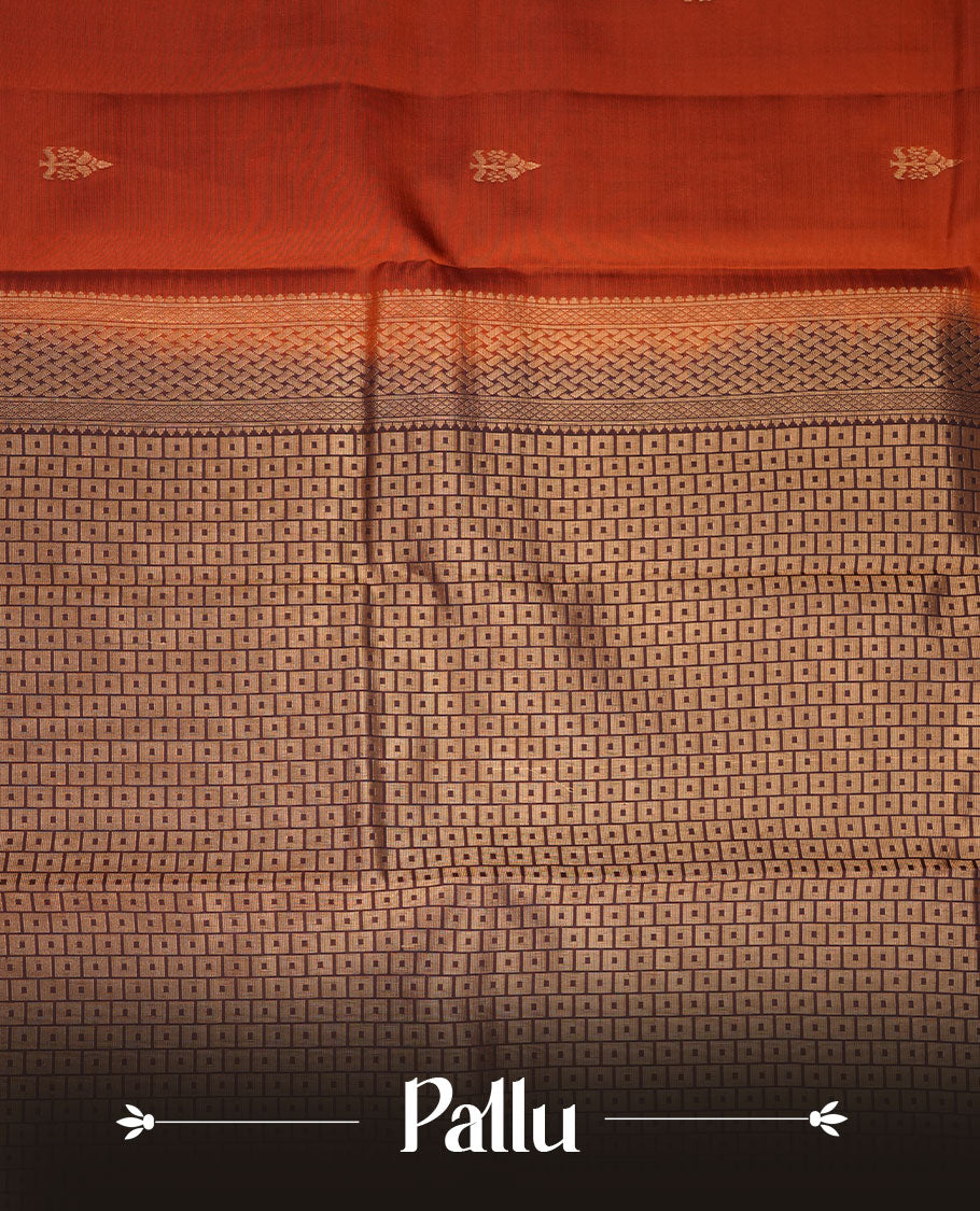 Brick red colour Vasundhara silk saree featuring zari motifs on body, complemented by contrast coffee brown colour with zari buttas border, paired with matching.