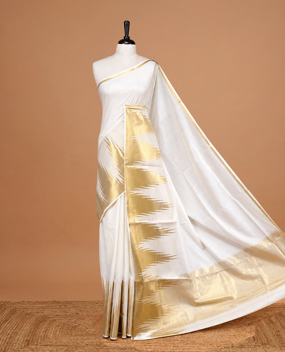 Cream Colour Cotton Kerala Saree Featuring  Temple Pattern On The Body ,Paired With A Matching Blouse Piece.