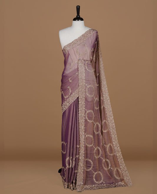 Purple colour organza saree featuring thread & gold stone pattern on body, highlighting scalp border, paired with Matching blouse piece.