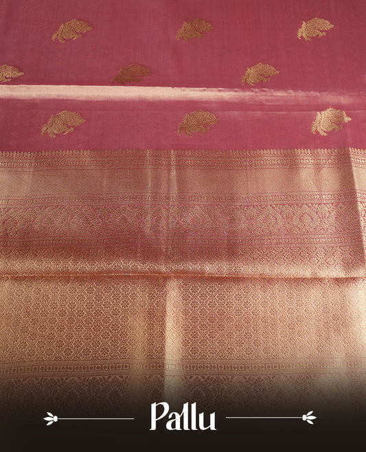 Dual tone peach and dark pink colour tissue brocade saree featuring antique gold zari motifs on the body with a rich traditional zari border and pallu, paired with a matching blouse piece.