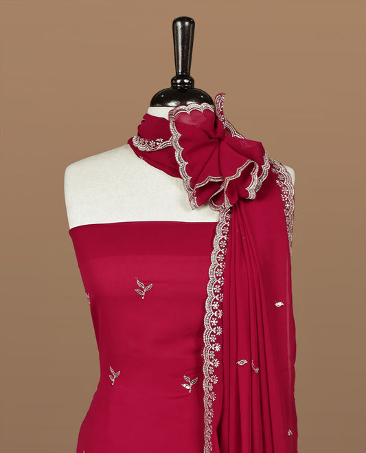 Red colour churidhar material featuring gold thread floral pattern on body, paired with matching bottom & dupatta.