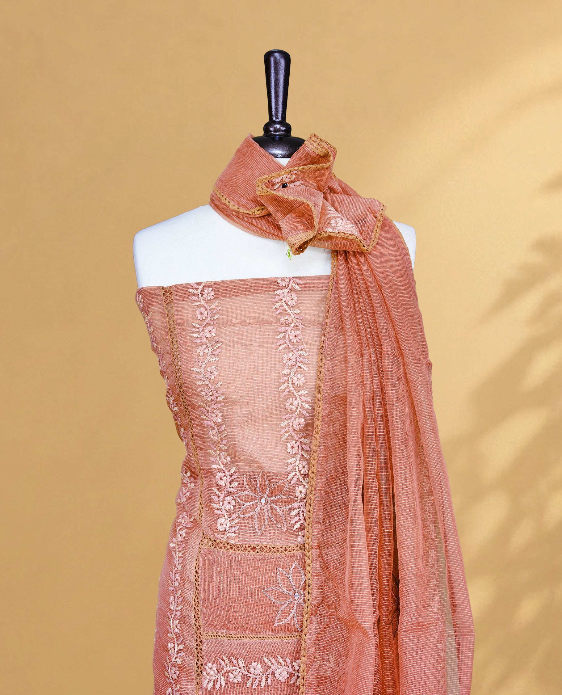 Copper Rose colour Salwar material featuring Self colour Floral Thread pattern, Matching bottom and paired with Same colour with thread patterned Dupatta.