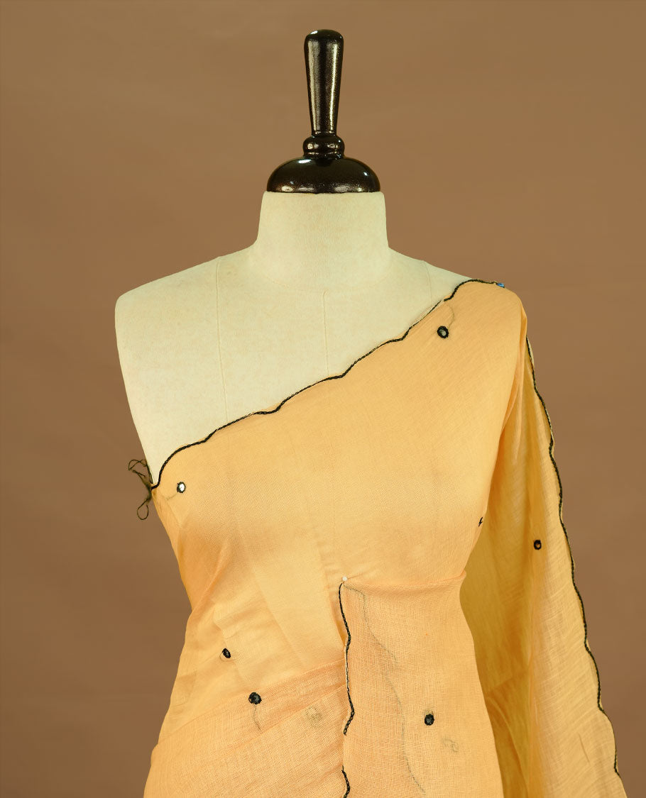 Beige colour Semi Linen saree featuring mirror work with intricate thread detailing, enhanced by a stylish scallop border. Comes without a blouse piece.