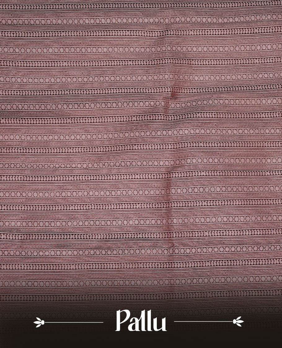 Chocolate brown colour soft silk saree featuring rose Gold zari motifs on body, complemented by self colour with traditional border, paired with matching blouse piece.