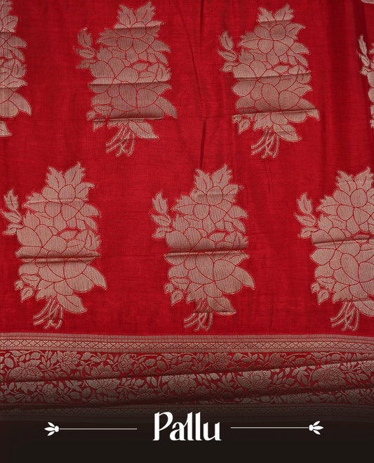 Red colour semi Tussar silk saree featuring an elegant plain body, complemented by a self colour border adorned with traditional gold zari floral kodi patterns. Comes paired with a matching blouse piece.