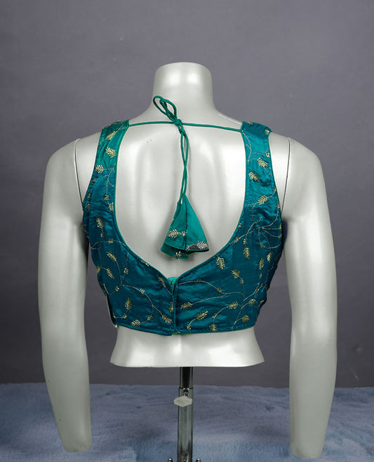 Teal colour embroidered padded blouse with gold vine detailing, V neckline, and tie-back finish.