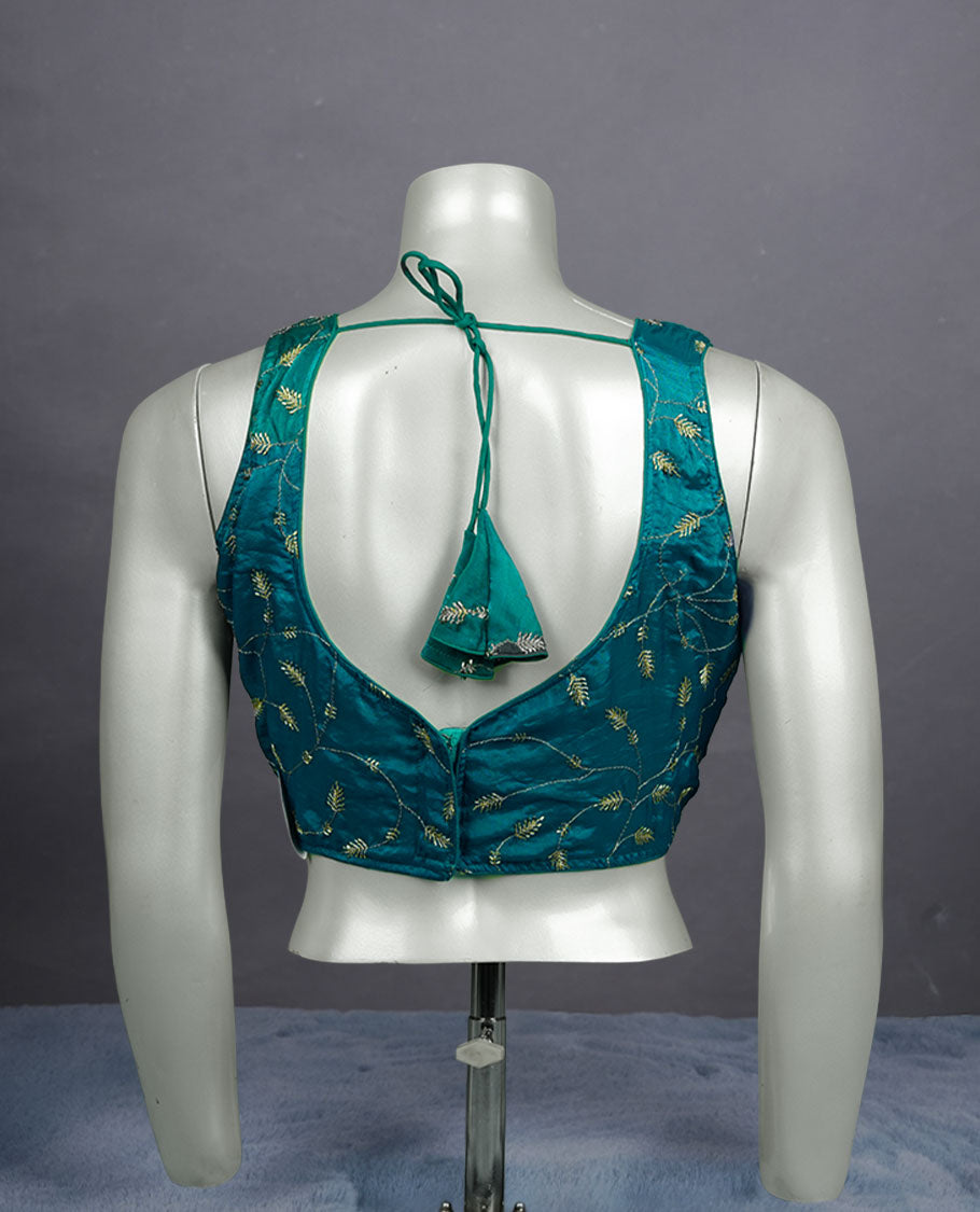 Teal colour embroidered padded blouse with gold vine detailing, V neckline, and tie-back finish.