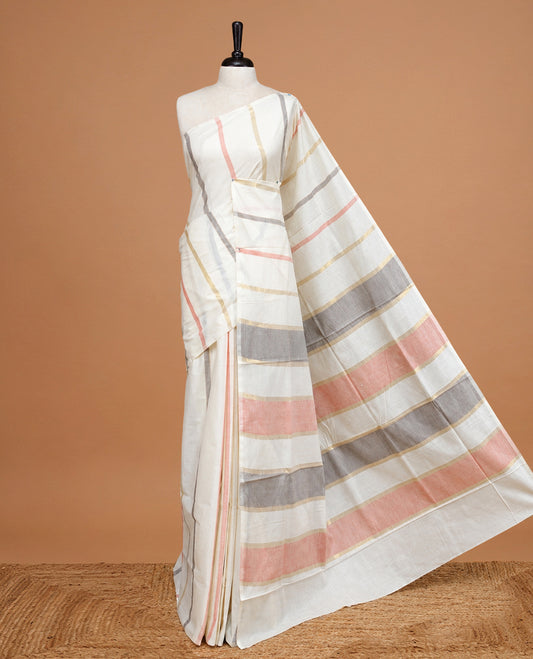 Cream Colour Cotton Kerala Saree Featuring Gray & Light Red Strips On The Body & Pallu, Paired With A Matching Blouse Piece.