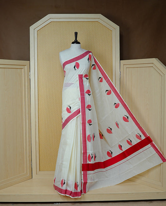 Cream colour Cotton Kerala saree Featuring Classy Plain body for Effortless Elegance, enhancing Red with Peacock Printed border, paired with matching blouse piece.