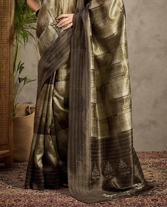 Olive Green toned semi Tussar saree featuring contemporary fancy prints across the body, enhanced with a subtle Katha style stitched border, paired with a matching blouse for a stylish and elegant ethnic look.